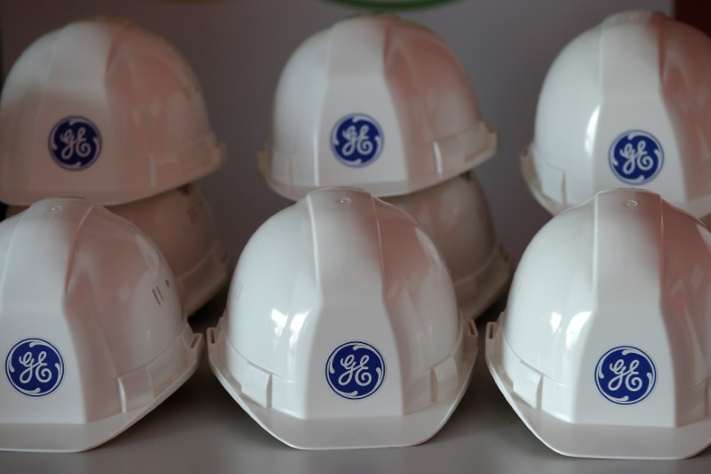 © Reuters. The General Electric logo is pictured on working helmets during a visit at the General Electric offshore wind turbine plant in Montoir-de-Bretagne