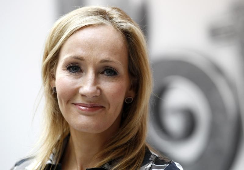 © Reuters. FILE PHOTO - British writer JK Rowling poses during the launch of new online website Pottermore in Londo
