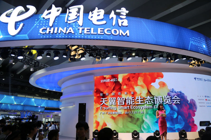 © Reuters. The logo of China Telecom is pictured at its booth during an expo in Guangzhou
