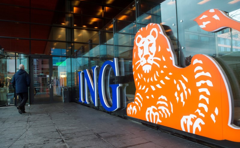 © Reuters. FILE PHOTO: A man walks past the logo of ING Group NV at a branch office in Amsterdam