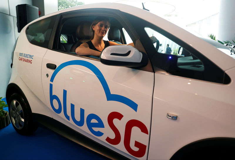 © Reuters. Marie Bollore, managing director of Blue Solutions poses in a BlueSG electric car-sharing vehicle during their launch in Singapore
