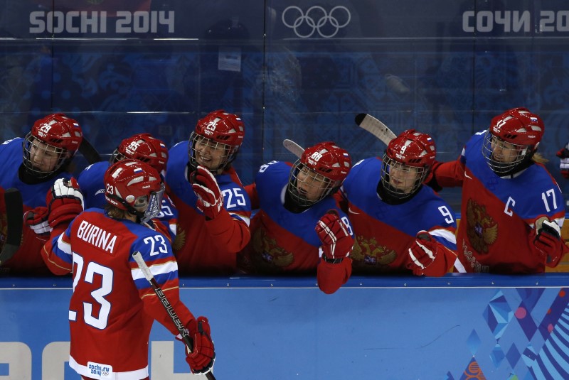 © Reuters. Russia celebrates after scoring on Japan during the first period of their women's ice hockey game at the 2014 Sochi Winter Olympics