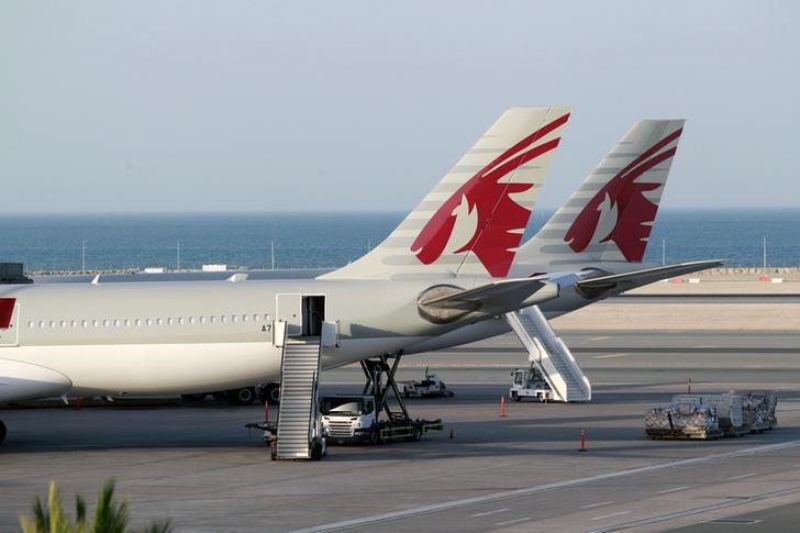 © Reuters. Qatar Airways aircrafts are seen at Hamad International Airport in Doha