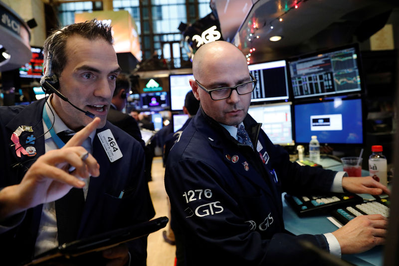 © Reuters. Traders work on the floor of the New York Stock Exchange shortly after the opening bell in New York