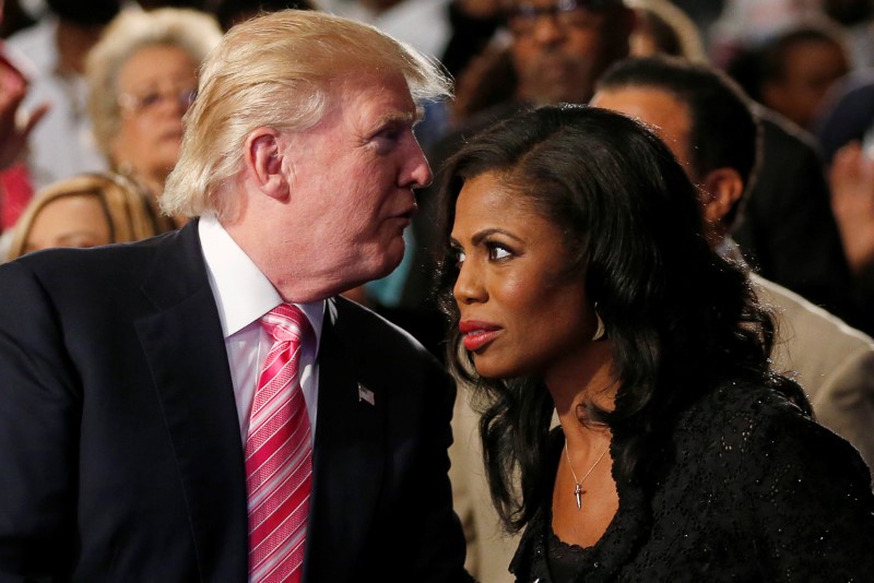 © Reuters. Republican presidential nominee Donald Trump and Omarosa Manigault (R) attend a church service, in Detroit, Michigan