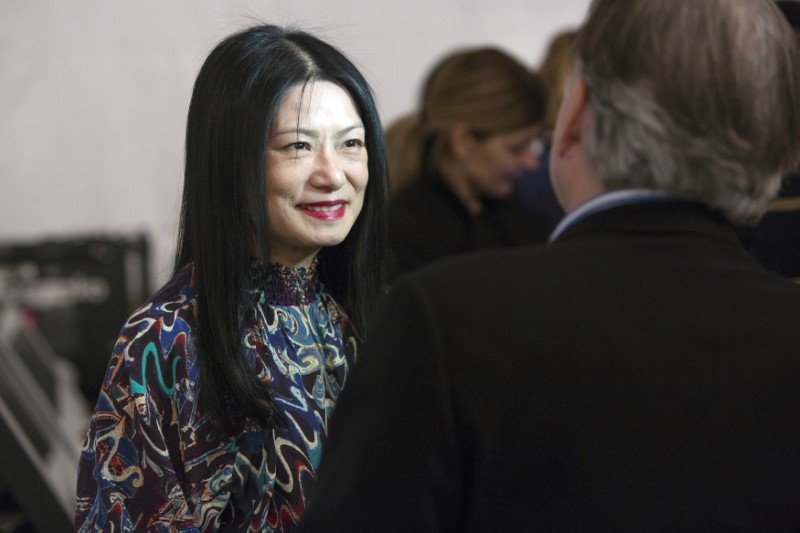 © Reuters. Designer Vivienne Tam speaks to media backstage before presenting her 2014 Fall/Winter collection during New York Fashion Week