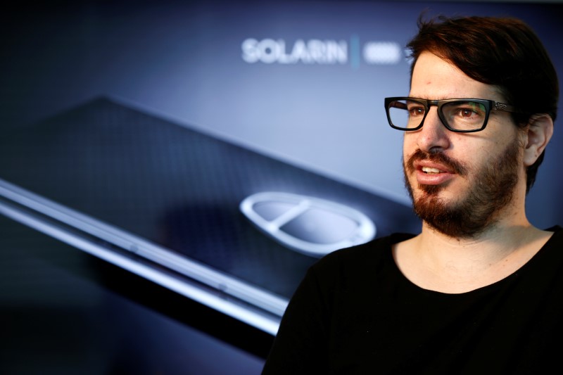 © Reuters. Moshe Hogeg, co-founder and president of British-Israeli start-up, Sirin Labs AG, manufacturers of Solarin, speaks during an interview with Reuters at their offices in Tel Aviv, Israel