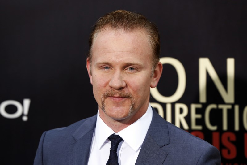 © Reuters. Director Morgan Spurlock arrives for the premiere of the documentary film "This is Us" about British boy band One Direction in New York