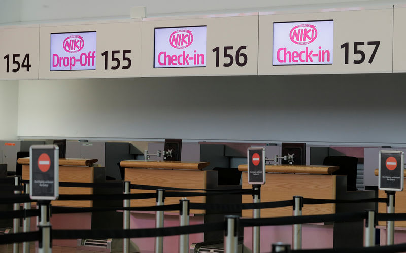 © Reuters. Empty Niki check-in counters are seen at Vienna International Airport in Schwechat