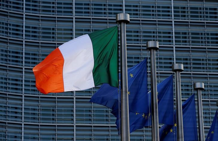 © Reuters. Irish and EU flags are pictured outside the EU Commission headquarters in Brussels