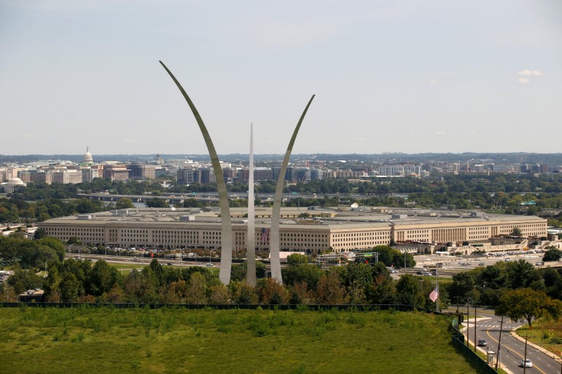 © Reuters. The Pentagon is shown with the Air Force Memorial in the fore ground in Arlington, Virginia