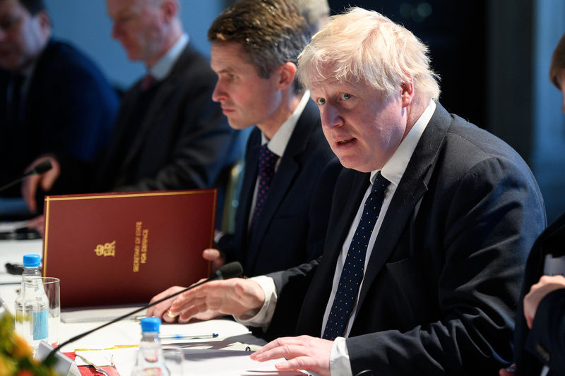 © Reuters. FILE PHOTO - British Foreign Secretary Boris Johnson takes part in a meeting with Japan's Defence Minister Itsunori Onodera and Foreign Minister Taro Kono at the National Maritime Museum in London