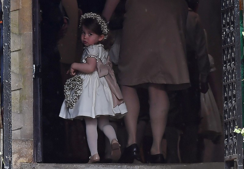 © Reuters. Britain's Princess Charlotte, a bridesmaid, attends the wedding of her aunt Pippa Middleton to James Matthews at St Mark's Church in Englefield