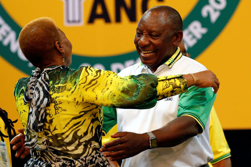 © Reuters. Deputy president of South Africa Cyril Ramaphosa greets an ANC member during the 54th National Conference of the ruling African National Congress (ANC) at the Nasrec Expo Centre in Johannesburg