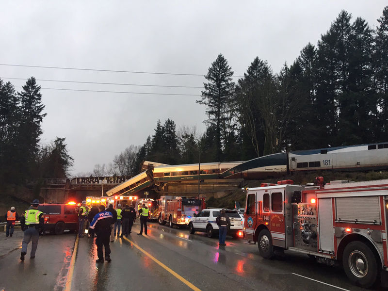 © Reuters. Washington State Patrol photo of first responders at the scene of an Amtrak passenger train derailment in DuPont