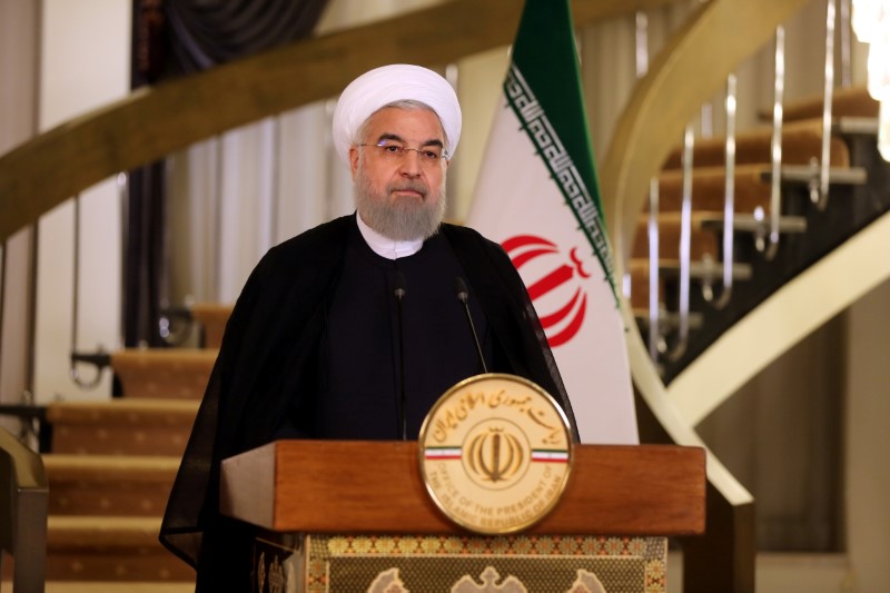 © Reuters. Iranian President Hassan Rouhani delivers a television address in Tehran