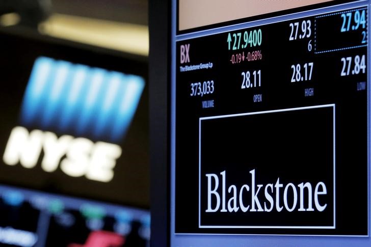 © Reuters. FILE PHOTO -  The ticker and trading information for Blackstone Group is displayed at the post where it is traded on the floor of the New York Stock Exchange