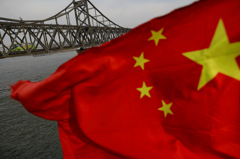 © Reuters. FILE PHOTO: A Chinese flag is seen in front of the Friendship bridge over the Yalu River connecting the North Korean town of Sinuiju and Dandong in China