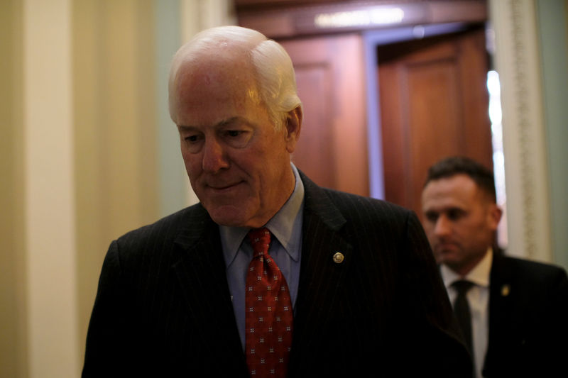 © Reuters. U.S. Senate Majority Whip Cornyn walks from his office to the Senate floor during debate over the Republican tax reform plan in Washington