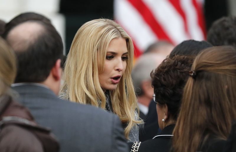 © Reuters. Ivanka Trump talks with attendees at a White House event after the U.S. Congress passed sweeping tax overhaul legislation, on the South Lawn of the White House in Washington