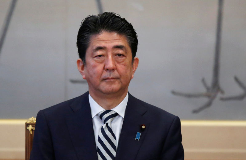 © Reuters. Japan's PM Abe attends a meeting of the Imperial Household Council to discuss the timeline for the abdication of Japan's Emperor Akihito at the Imperial Household Agency in Tokyo