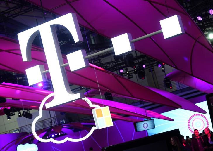 © Reuters. Deutsche Telekom logo is seen during preparations at the CeBit computer fair in Hanover