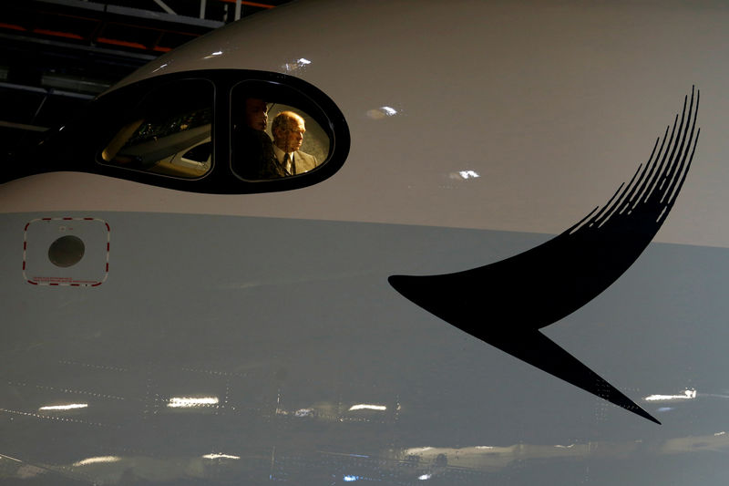 © Reuters. FILE PHOTO: Pilots look out from cockpit as Cathay Pacific Airways holds a ceremony to mark the first of the airlines' 48 Airbus A350 arrived at Hong Kong Airport