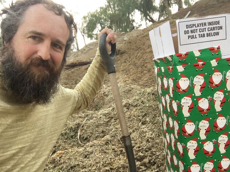 © Reuters. Robert Strong is seen next to a gift-wrapped box in this photo released by Robert Strong of Eagle Rock