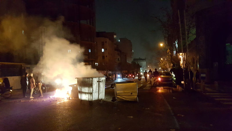 © Reuters. People protest in Tehran