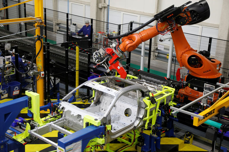 © Reuters. A welding robot assembles bodyworks on the new Alpine A110 sports car during the inauguration of the new production line in Dieppe