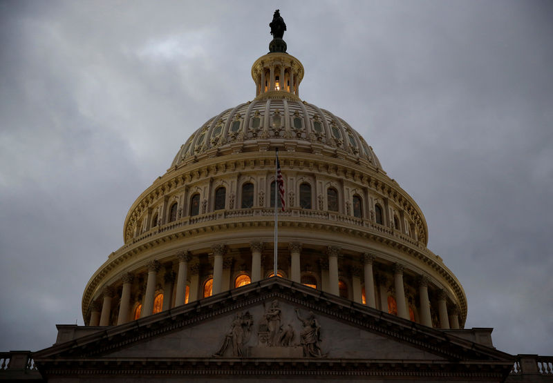 © Reuters. FILE PHOTO: The U.S. Capitol building is lit at dusk ahead of planned votes on tax reform in Washington