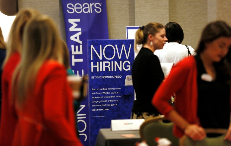 © Reuters. Recruiters and job seekers are seen at a job fair in Golden