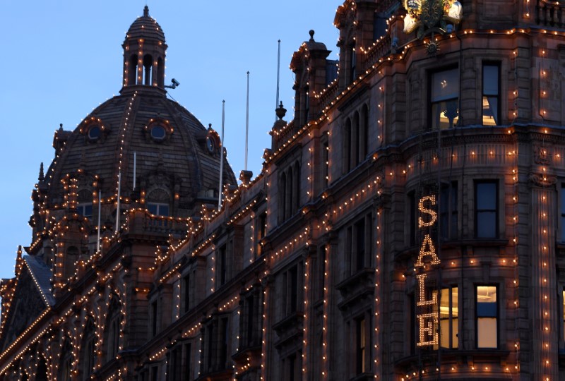 © Reuters. A sale sign is seen at dawn on the outside of the Harrods store in Knightsbridge in London