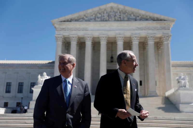 © Reuters. Senate Judiciary Committee Chairman Sen. Chuck Grassley (R-IA) and Sen. Lindsey Graham (R-SC) arrive for a rally for nominee Neil Gorsuch outside the Supreme Court