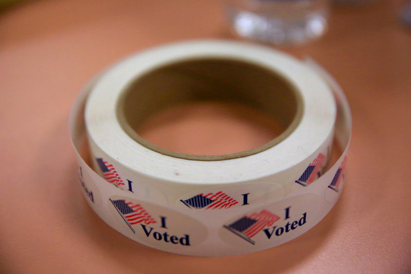 © Reuters. FILE PHOTO: Voting stickers are seen as voters cast their ballots for the Ohio primary at Saint Columba Social Hall in Youngstown, Ohio