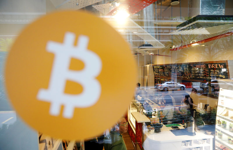 © Reuters. FILE PHOTO: A view of Ducatus cafe the first cashless cafe that accepts cryptocurrencies such as Bitcoin on their opening day in Singapore