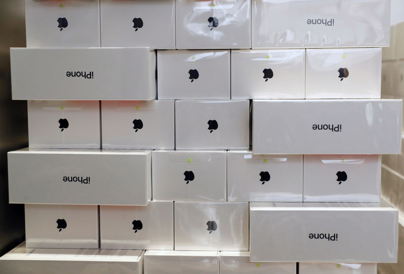 © Reuters. FILE PHOTO: Boxes of iPhone X are pictured during its launch at the Apple store in Singapore