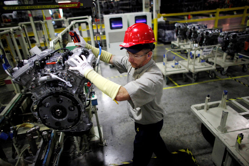 © Reuters. FILE PHOTO: A Toyota automaker employee moves an engine at the Toyota engine assembly line in Huntsville, Alabama