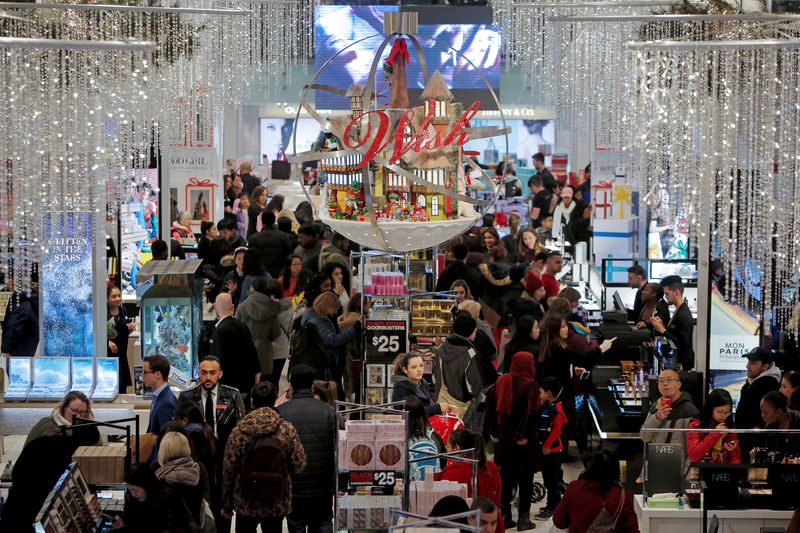 © Reuters. FILE PHOTO: People shop in Macy's Herald Square during early opening for the Black Friday sales in Manhattan