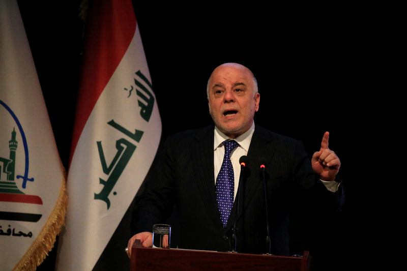 © Reuters. Iraq's Prime Minister Haider al-Abadi speaks during a ceremony in Najaf
