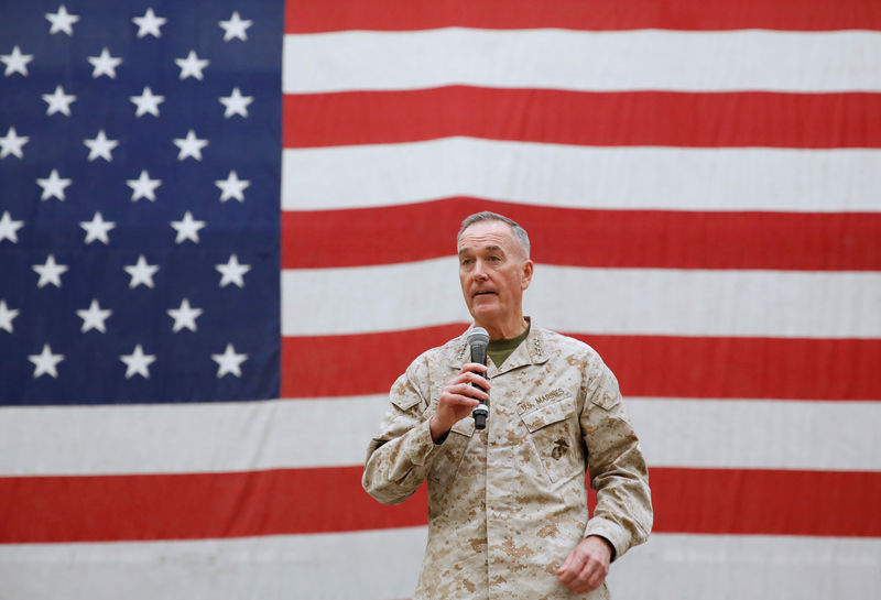 © Reuters. Gen. Joseph Dunford, chairman of the Joint Chiefs of Staff, speaks during celebrations on Christmas Eve at a U.S. airfield in Bagram