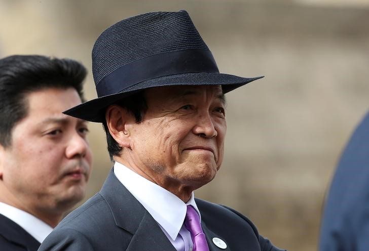 © Reuters. Japanese Finance Minister Taro Aso leaves the G7 for Financial ministers meeting in the southern Italian city of Bari