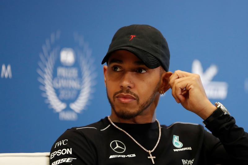 © Reuters. FILE PHOTO - Mercedes' Formula One driver Lewis Hamilton attends the FIA Champions news conference for FIA Prize Giving 2017 in Paris