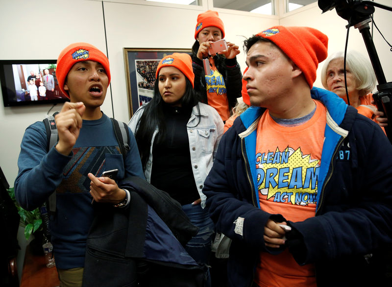 © Reuters. Protesters calling for an immigration bill addressing the so-called Dreamers, young adults who were brought to the United States as children, crowd in to the office of Senator Chuck Grassley in Washington