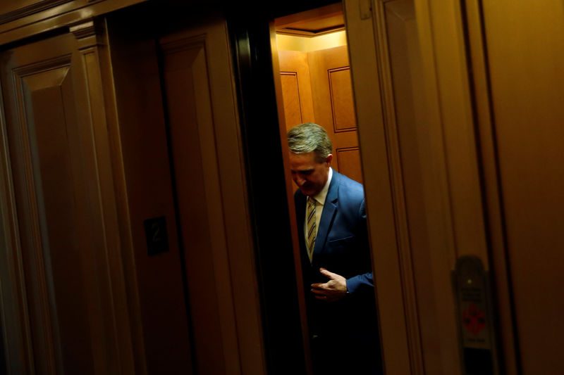 © Reuters. Flake departs the Senate floor at the U.S. Capitol in Washington