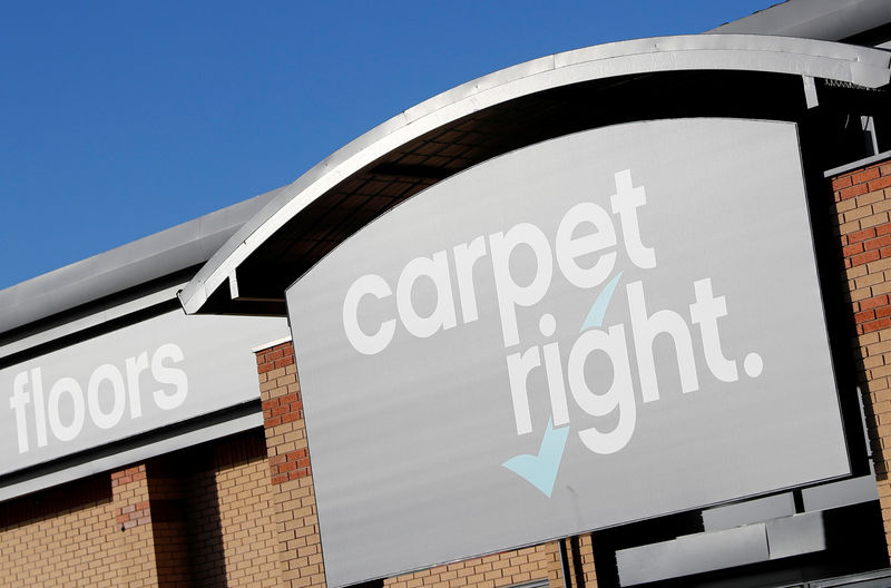 © Reuters. A sign hangs above the door of a Carpetright store in Derby
