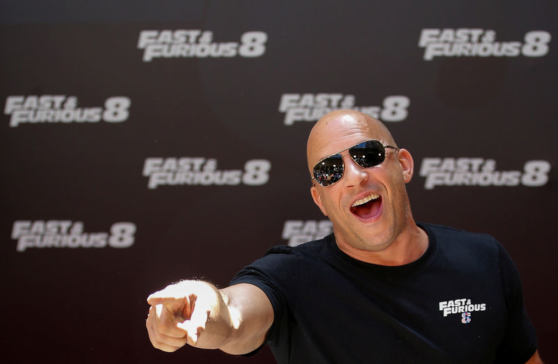 © Reuters. FILE PHOTO: Actor Vin Diesel reacts as he poses during a photocall to promote his film "Fast & Furious 8" in Madrid