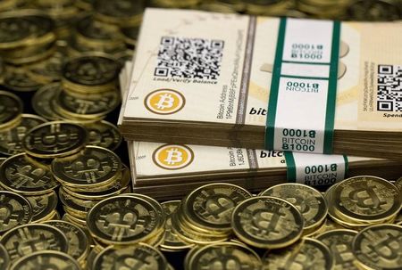 © Reuters. Some of Bitcoin enthusiast Mike Caldwell's coins and paper vouchers often called 