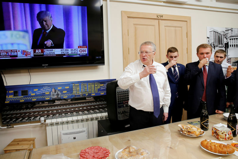 © Reuters. FILE PHOTO:  Head of the LDPR Zhirinovsky celebrates Donald Trump's election as president by drinking sparkling wine with other party members during a break in the session of the State Duma in Moscow