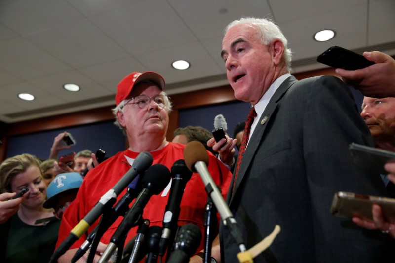 © Reuters. Rep. Patrick Meehan (R-PA), accompanied by Rep. Joe Barton (R-TX), speaks with the media at the U.S. Capitol Building in Washington